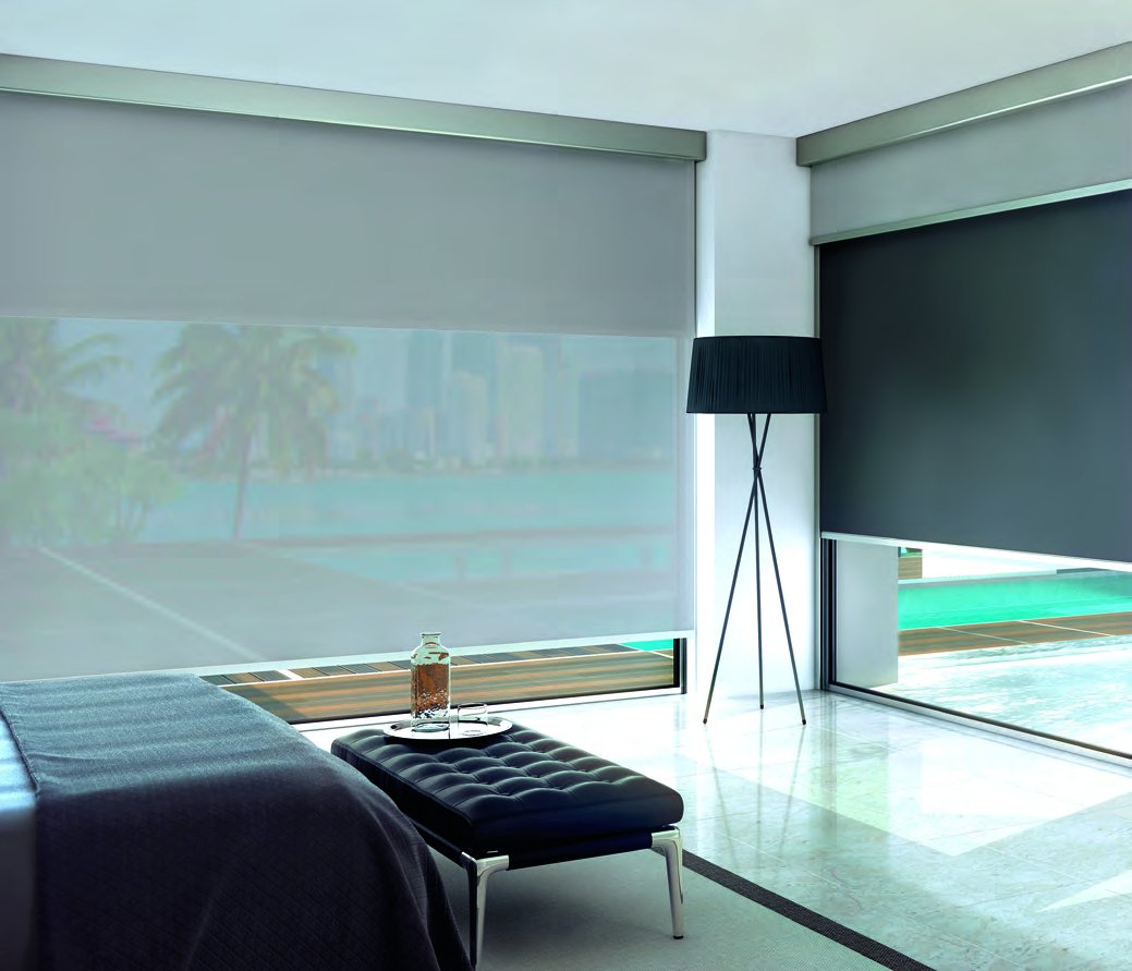 B-Box Duo dual roller shade in a bedroom overlooking a coastal skyline