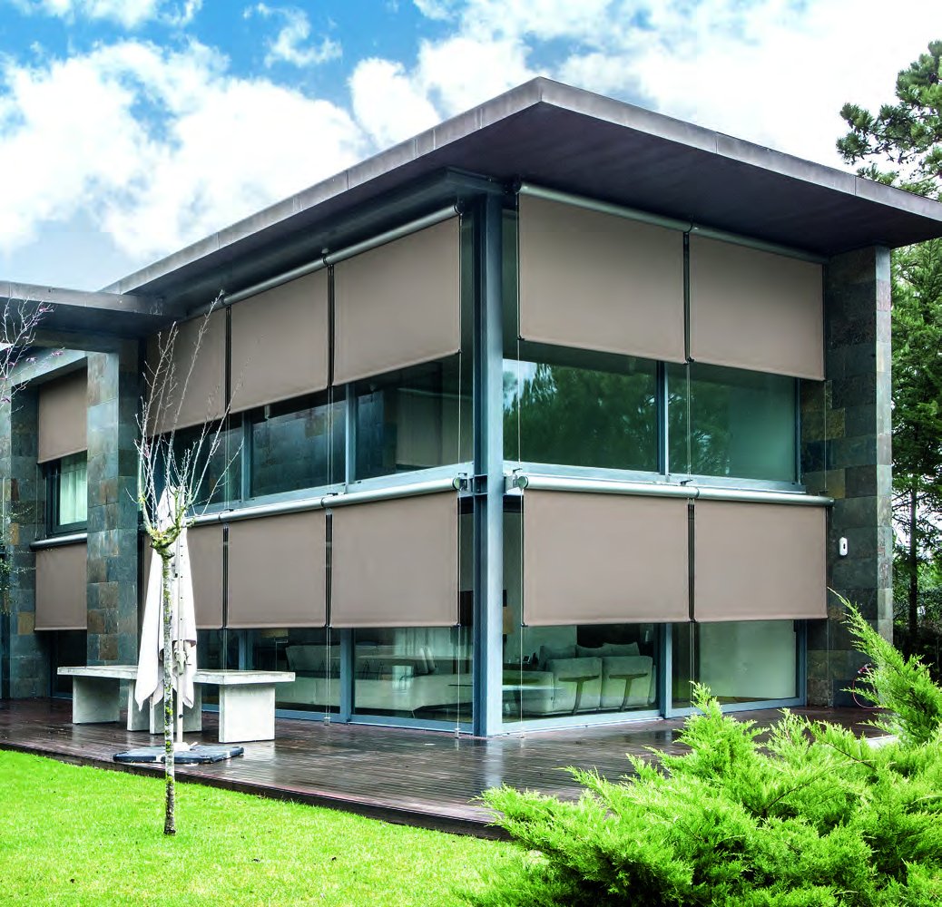 O-Box exterior drop-arm screens on a modern building facade